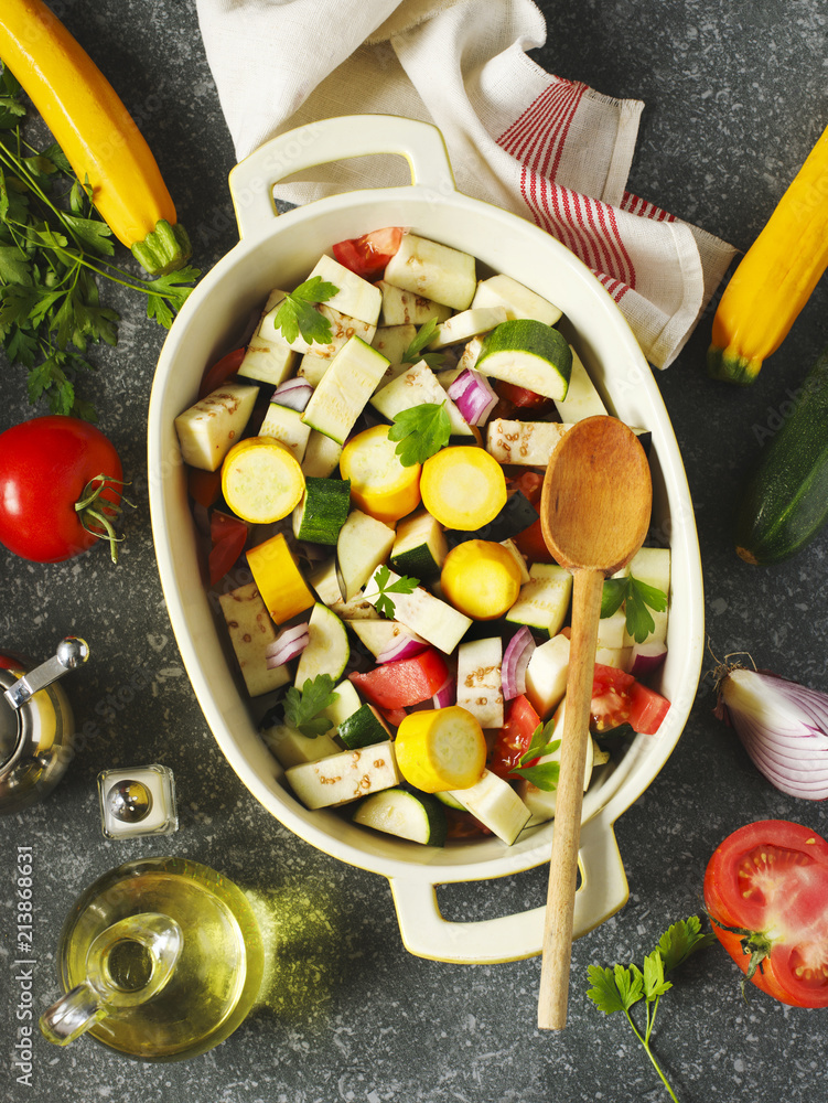 Obraz na plátně Fresh vegetables and cooking pan on table, top view