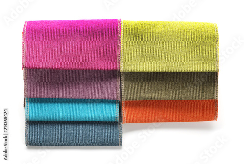 Fabric samples of different colors for interior design on white background