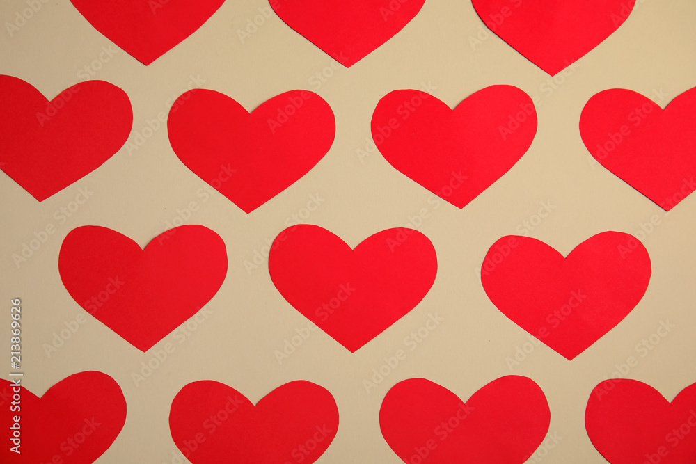 Small paper hearts on color background, top view Small paper hearts on color background, top view