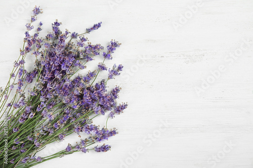 Beautiful blooming lavender flowers on light background, top view