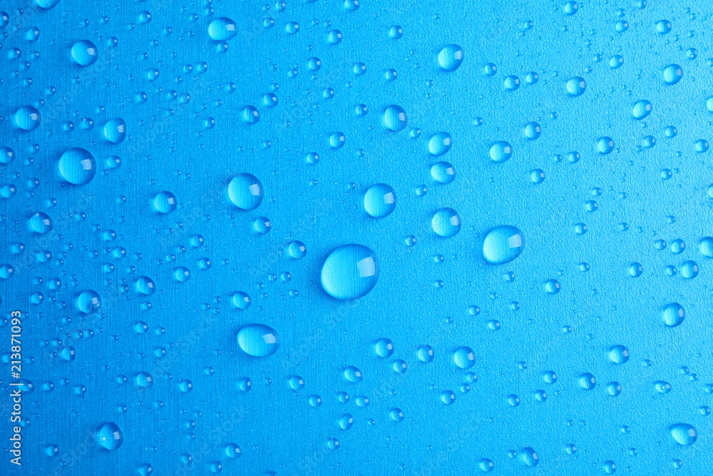 Many clean water drops on color background