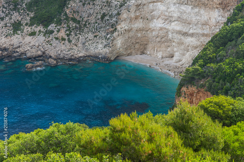 Blue water and rocks of beach at Zakynthos island, Greece