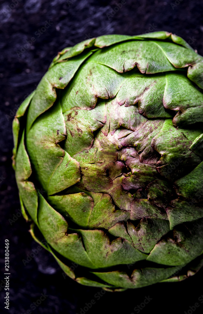 Obraz premium ARTICHOKE. Close up of artichoke, top view, dark background. Macro