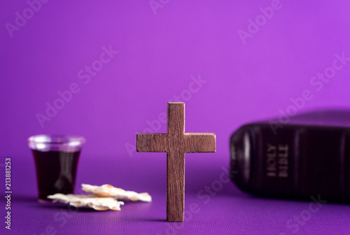 Symboles of Christianity and the Communion on a Purple Background photo