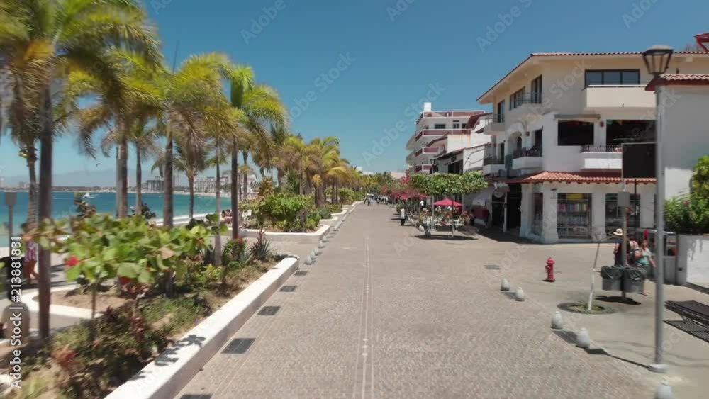 Aerial clip flying over Puerto Vallarta seaside promenade, a 12 mile long walking esplanade in Puerto Vallarta, Mexico. Aerial clip flying over Puerto Vallarta seaside promenade, a 12 mile long walking esplanade in Puerto Vallarta, Mexico.