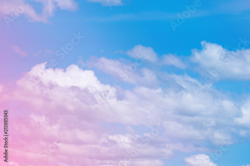 Sweet pastel colored cloud and sky with sun light, soft cloudy with gradient pastel color background. © pookpiik