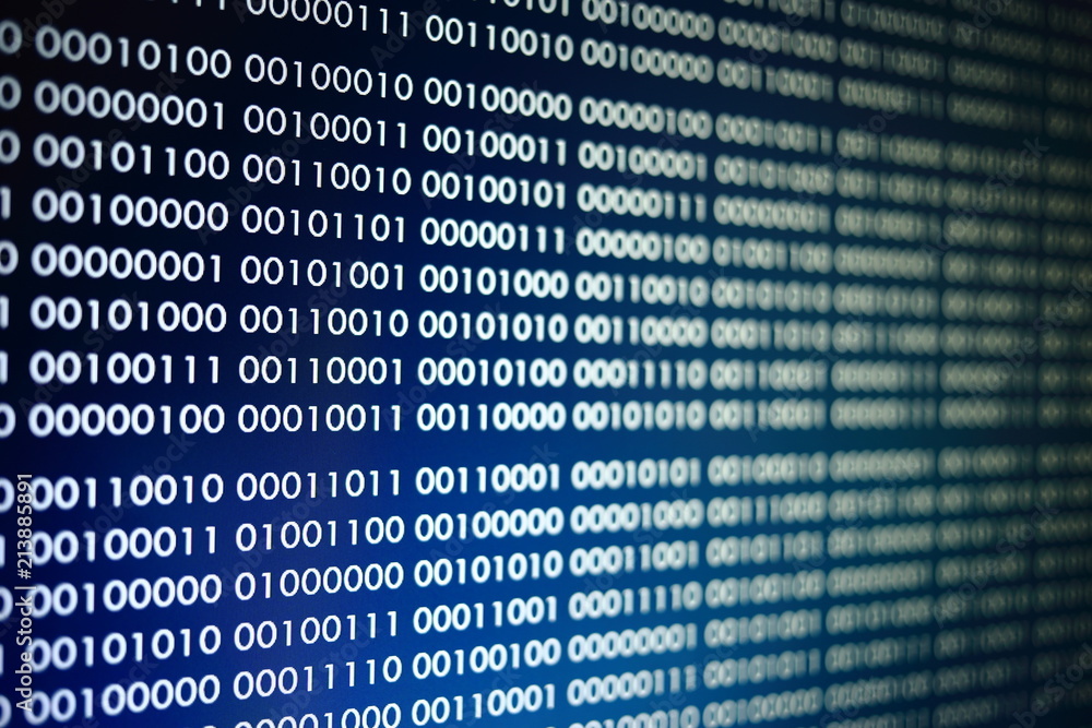 blocks of binary data. Blockchain concept. blue background with computer digital binary code bit number one and zero text. selective focus on the far end of the computer display out of focus in front. blocks of binary data. Blockchain concept. blue background with computer digital binary code bit number one and zero text. selective focus on the far end of the computer display out of focus in front.