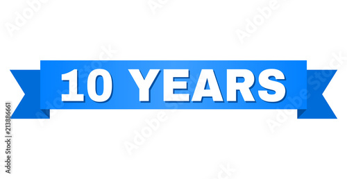 10 YEARS text on a ribbon. Designed with white caption and blue tape. Vector banner with 10 YEARS tag.