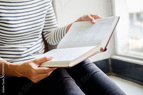 Woman is reading and praying over bible © MIND AND I