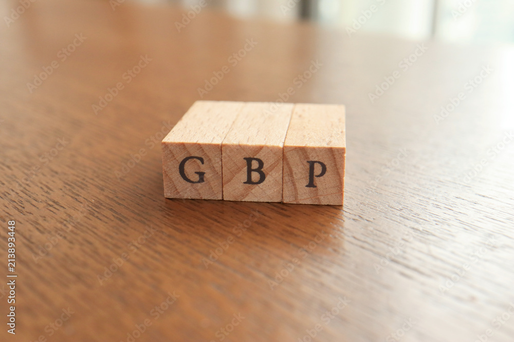 GBP (Great Britain Pound) Text Block on Wooden Table GBP (Great Britain Pound) Text Block on Wooden Table