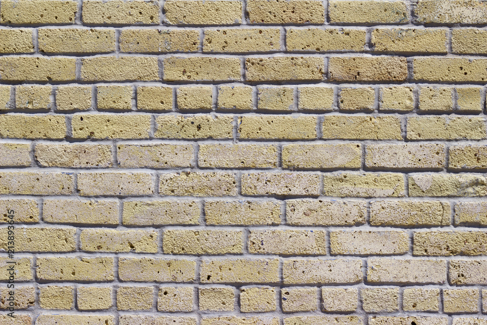 Obraz premium Antique beige white brick wall background with grunge look