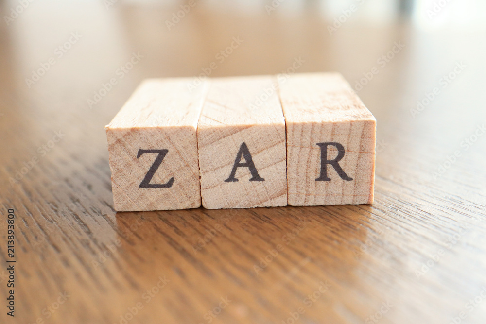 ZAR (South African Rand) Text Block on Wooden Table ZAR (South African Rand) Text Block on Wooden Table