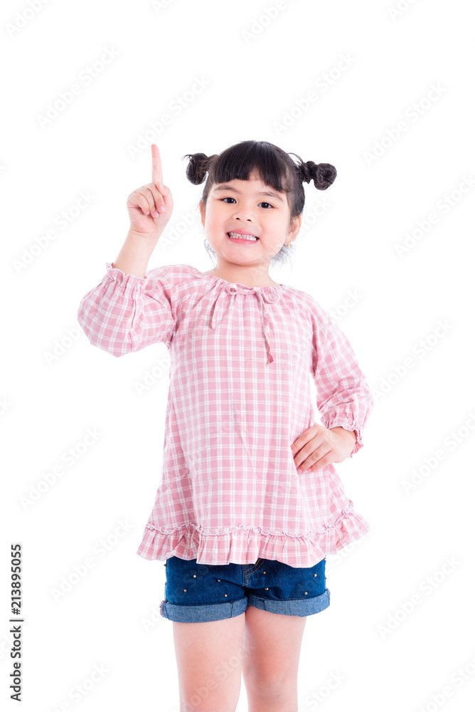 Little asian girl pointing finger up and smiles over white background Little asian girl pointing finger up and smiles over white background