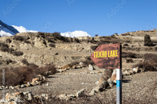 Sign indicating the way to the Tilicho lake along the Annapurna circuit in the Himalayas in Nepal near Manang