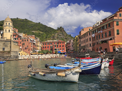 Vernazza harbor on Mediterranean coast with fishing boats on the foreground, Cinque Terre, Italy