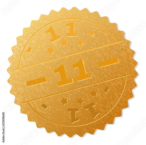 11 gold stamp seal. Vector gold medal of 11 text. Text labels are placed between parallel lines and on circle. Golden surface has metallic texture.