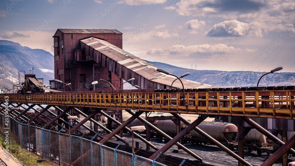 Fototapeta premium Panoramic view of old abandoned industrial zone with old wagons and conveyor.Lots of old and rusted stuff. Bakar, Croatia, Europe. .