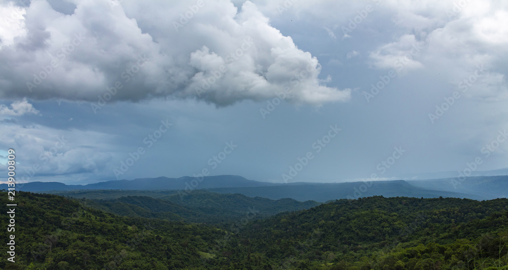 Beautiful mountain landscape thailand, with mountain peaks covered with forest and a cloudy sky.