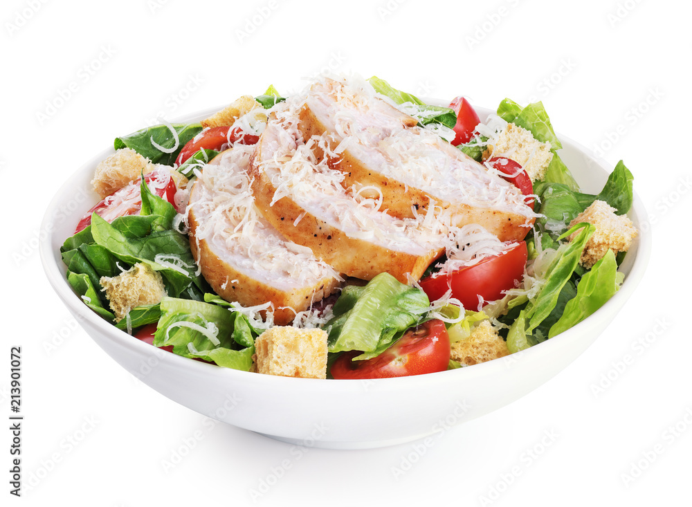 Caesar salad with chicken fillet and parmesan cheese isolated on white background.
