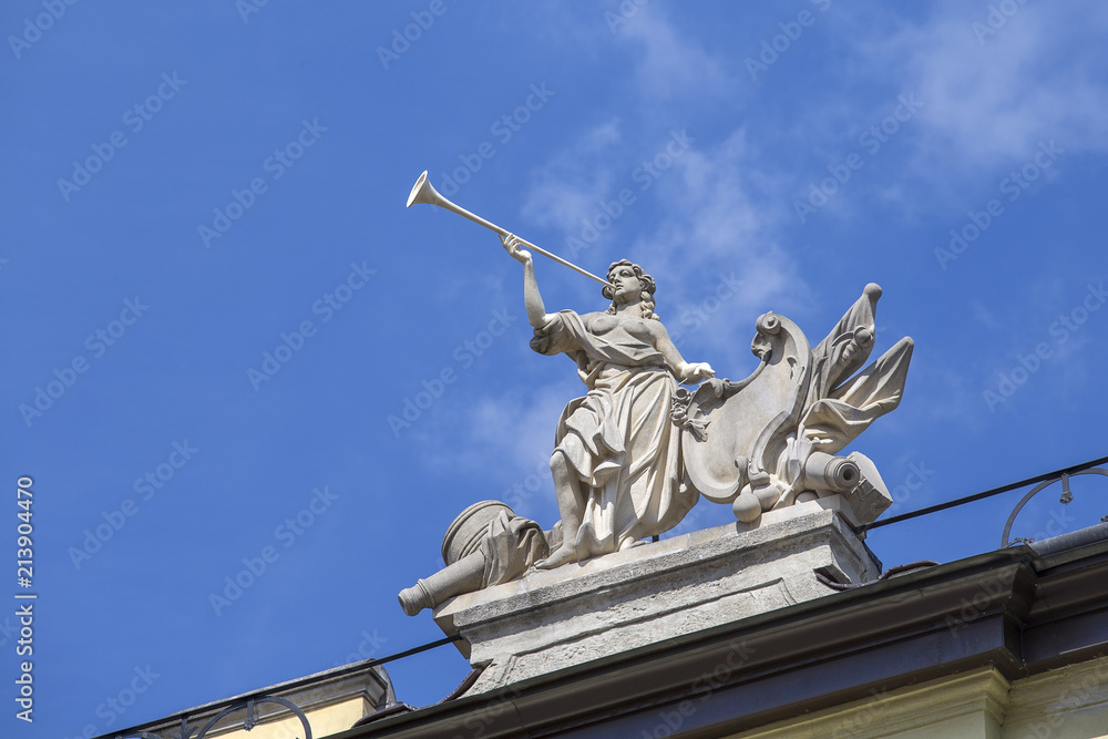 Sculptural composition on top of a building on Market Square in Lviv, Ukraine