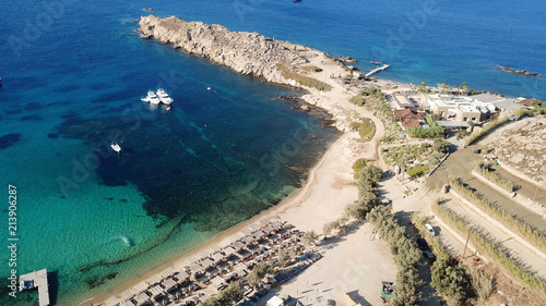 Aerial drone bird's eye view from famous beach of Paraga with emerald waters, Mykonos island, Cyclades, Greece photo