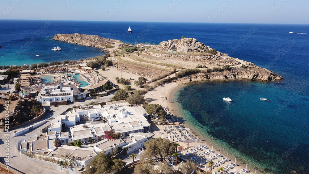 Aerial drone bird's eye view from famous beach of Paraga featuring famous night club of Skorpios and Santanna with largest pool in Europe and Skorpios beach, Mykonos island, Cyclades, Greece