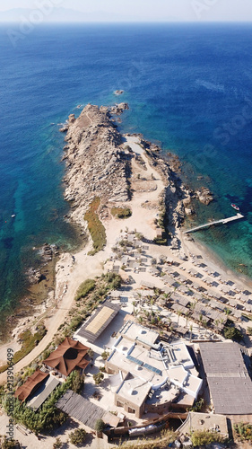 Aerial drone bird's eye view from famous beach of Paraga featuring famous night club of Skorpios and Santanna with largest pool in Europe and Skorpios beach, Mykonos island, Cyclades, Greece