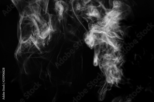 Fototapeta Naklejka Na Ścianę i Meble -  smoke from incense in front of black background