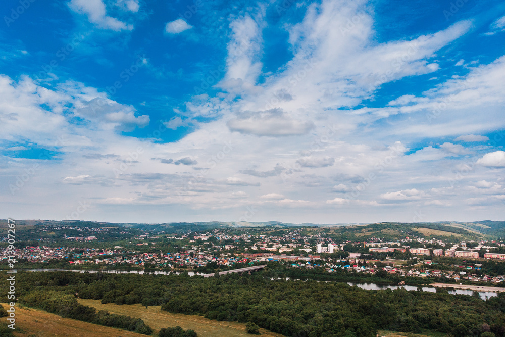 Fototapeta premium Osinniki, RUSSIA - July 17, 2018: Aerial photography of city in Kemerovo region, city near river
