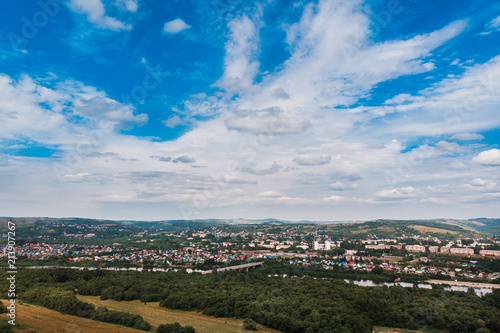 Osinniki, RUSSIA - July 17, 2018: Aerial photography of city in Kemerovo region, city near river
