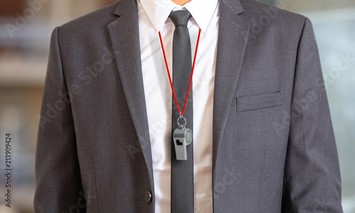 Man in suit wearing a whistle with red string. 3d illustration photo