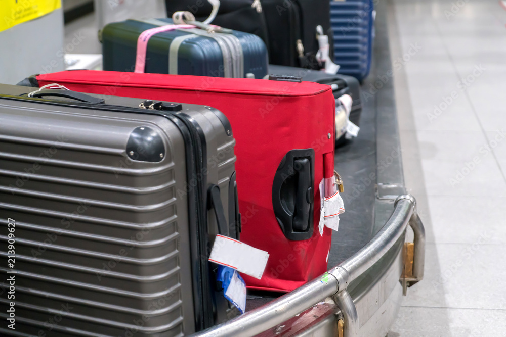 Suitcase or luggage with conveyor belt in the airport Suitcase or luggage with conveyor belt in the airport