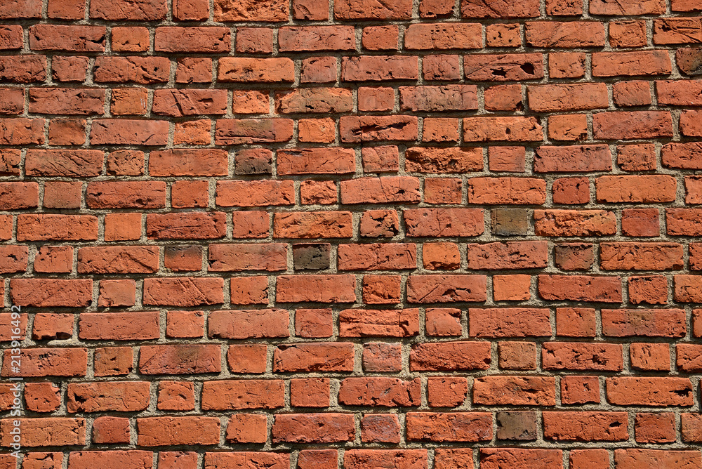 Naklejka premium Red brick city wall texture and background