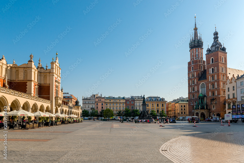Obraz market square in the center of the city of Krakow on a sunny day. Shopping arcade and the Church of St. Mary in the square