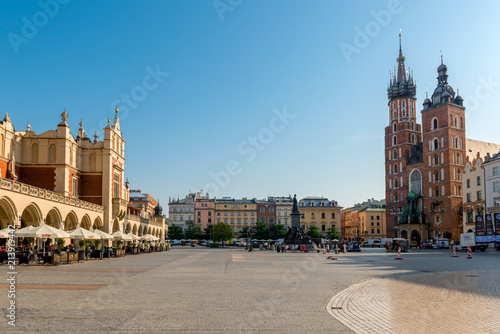market square in the center of the city of Krakow on a sunny day. Shopping arcade and the Church of St. Mary in the square