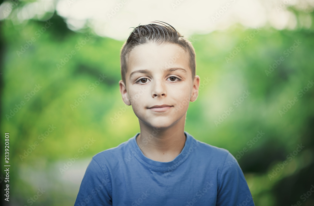 photo with a portrait of a boy outdoors photo with a portrait of a boy outdoors