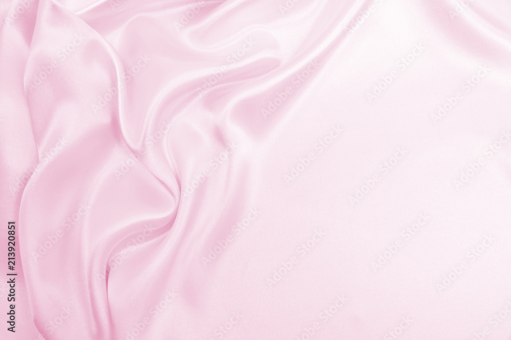Fototapeta premium Smooth elegant pink silk or satin texture as wedding background. Luxurious background design