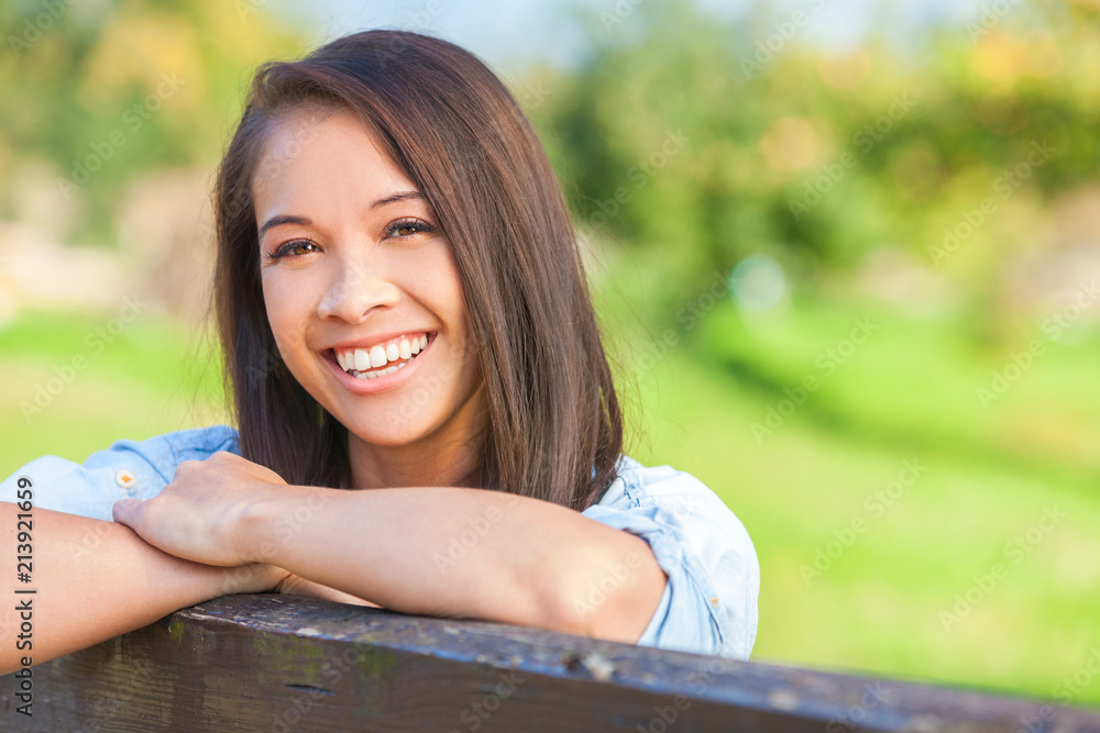 Beautiful Asian Eurasian Girl Resting on Fence Beautiful Asian Eurasian Girl Resting on Fence