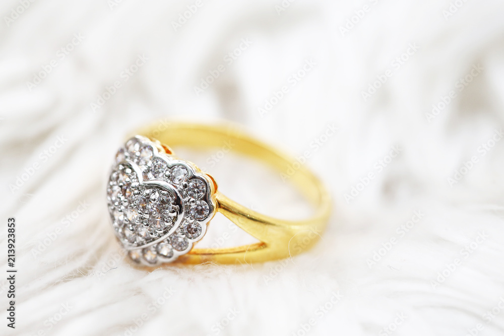 Diamond heart symbol on gold ring Diamond heart symbol on gold ring