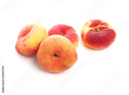 Tasty organic doughnut peaches on white