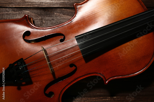 Violin on brown wooden table