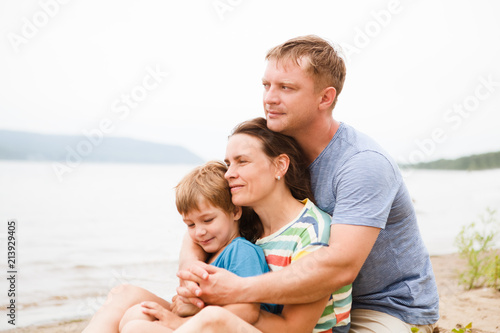 happy family mother, father and little son Having Fun outdoors in summer. Concept of friendly family.