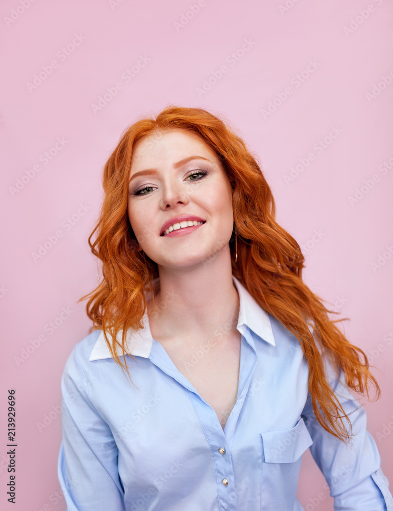 Portrait of beautiful red-haired girl on pink background Portrait of beautiful red-haired girl on pink background