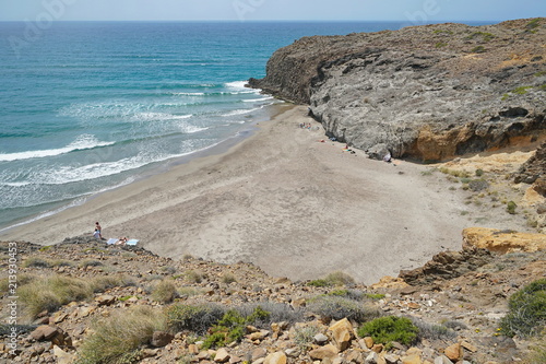 Rocky coast with a sandy beach in the Cabo de Gata-Níjar natural park, Playa del Barronal, Mediterranean sea, Almeria, Andalusia, Spain