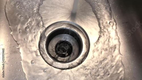 Water draining down a sink. photo
