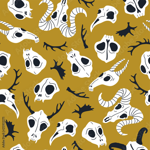 Vector seamless pattern with animal skulls. Halloween or Day of the dead design for fabric with cute skulls and horns.