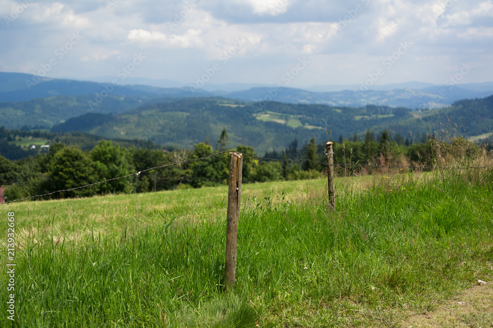 Field and meadow in Silesian Beskids, Poland - beautiful nature with hills and mountains. Field and meadow in Silesian Beskids, Poland - beautiful nature with hills and mountains.