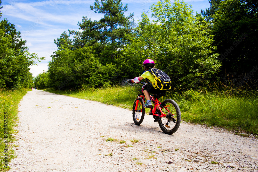 Little girl going in bicycle Little girl going in bicycle