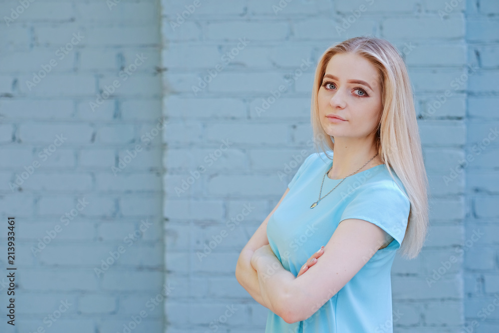 Portrait of beautiful young woman with blond hair and long eyelashes, summer outdoors Portrait of beautiful young woman with blond hair and long eyelashes, summer outdoors