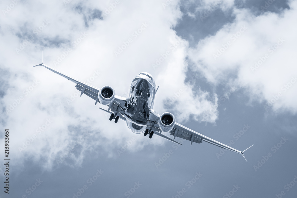 blue toned passenger jet cross-wind landing blue toned passenger jet cross-wind landing